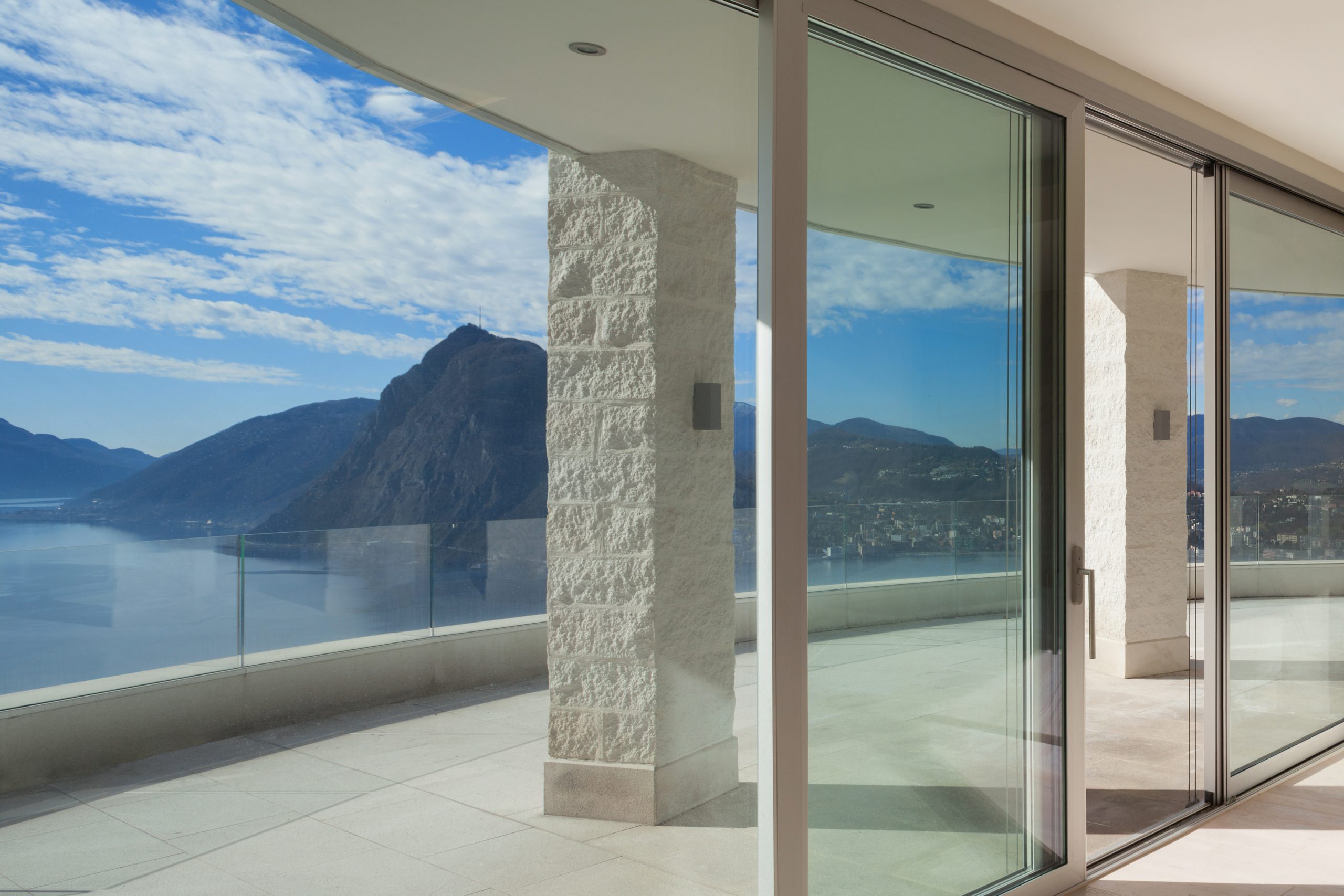 Interior of a penthouse, room with big windows, panoramic terrace